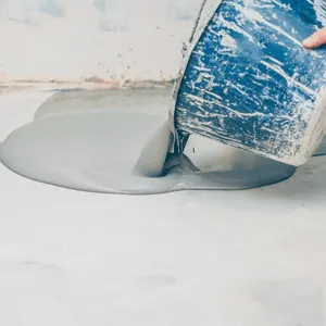 Thick epoxy base layer pour illustrates structural benefits of epoxy garage floor in garages