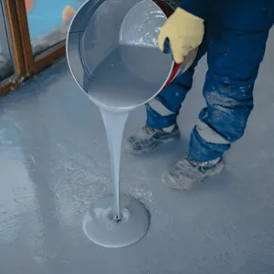 Pouring liquid epoxy shows the benefits of epoxy garage floor during early installation stages