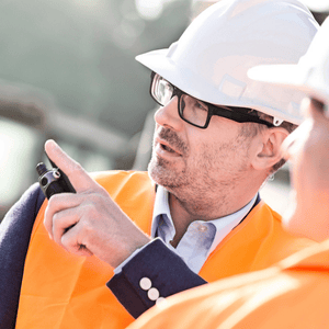 Polished concrete professionals supervising on-site operations to maintain polished concrete flooring excellence standards