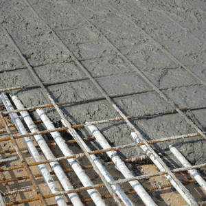 Rebar and pipes are embedded as part of concrete restoration for strong structural reinforcement