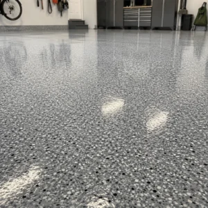 This close-up image shows a shiny flaked epoxy garage floor fort worth homeowners may choose for a durable and easy-to-clean garage surface